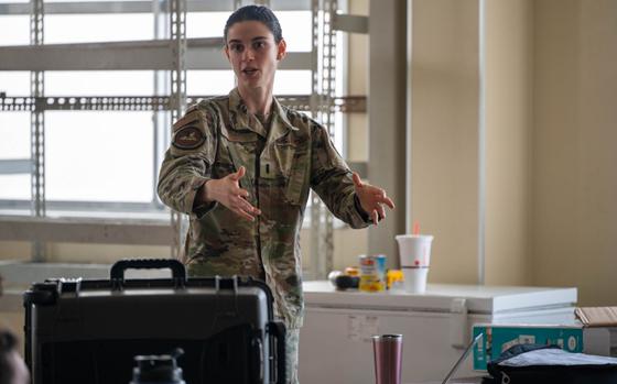 U.S. Air Force 1st Lt. Sarah Rego, 35th Civil Engineer Squadron Rapid Airfield Damage Repair (RADR) officer in charge, briefs Airmen on the RADR process at Misawa Air Base, Japan.