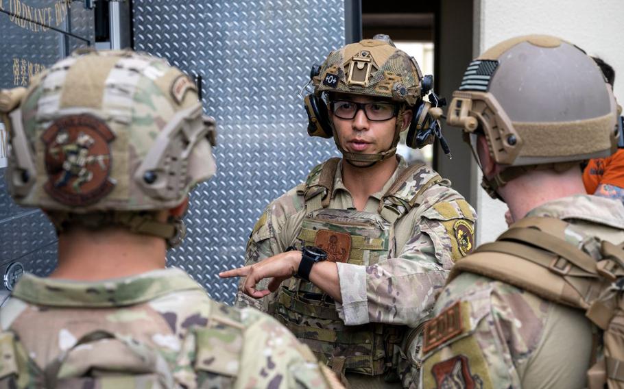 U.S. Air Force Staff Sgt. Sho Kasahara, 35th Civil Engineer Squadron explosive ordnance disposal (EOD) technician, gives instructions to his team before engaging in an explosive vest scenario during an Operation Sentinel Samurai exercise at Misawa Air Base, Japan, Sept. 17, 2024.