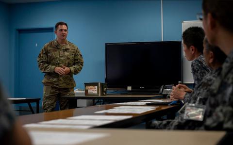 Photo Of U.S. Air Force Staff Sgt. Brandon Davisson, 374th Logistics Readiness Squadron air transportation specialist, answers a question during a joint inspection training in support of exercise Resolute Force Pacific 2025.