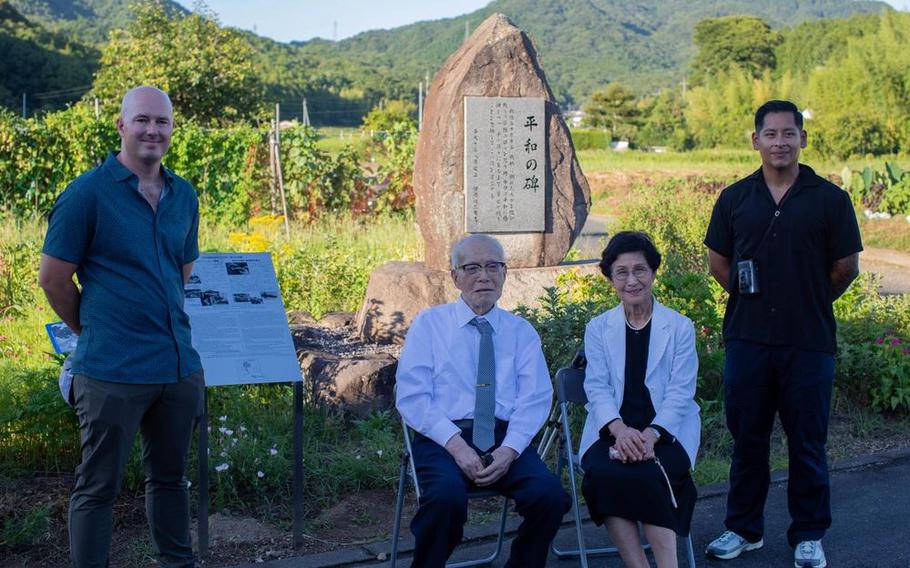From left to right, U.S. Marine Corps Maj. Mason Englehart, communication strategy and operations director, Headquarters and Headquarters squadron (H&HS), Marine Corps Air Station Iwakuni, Shigeaki Mori, a Japanese historian and a survivor of the atomic bombing of Hiroshima, Kayoko Mori, the wife of Mr. Mori, and Gunnery Sgt. Miguel Rosales, communication strategy operations chief, H&HS, MCAS Iwakuni, pose for a group photo during a memorial event, Yanai, Japan.