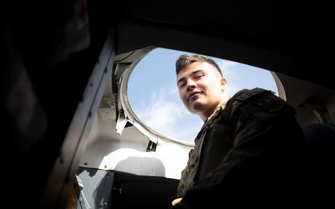 Photo Of U.S. Air Force Senior Airman Jacob Oseguera, 374th Civil Engineering Squadron firefighter, poses for photo while climbing a ladder inside a C-5M Super Galaxy, assigned to the 60th Air Mobility Wing, Travis Air Force Base, CA, at Yokota Air Base, Japan, March 19, 2024.