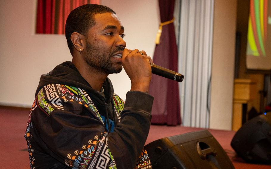 U.S. Air Force Senior Airman Matthew Williams, 374th Force Support Squadron military postal clerk, performs spoken word during the Black History Month closeout event at Yokota Air Base, Japan, March 2, 2024. The 374th Airlift Wing, in collaboration with the Yokota African-American Heritage Committee, hosted many events throughout the month aimed at immersing the community in black culture and the arts.