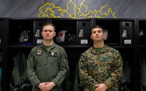 Photo Of U.S. Marine Corps Gysgt. David Emerton, equal opportunity advisor for Headquarters and Headquarters Squadron, Marine Corps Air Station Iwakuni, watches his brother Staff Sgt. Billy Emerton, a flight equipment technician, with Marine Fighter Attack Squadron (VMFA) 242, Marine Aircraft Group 12, 1st Marine Air Wing.