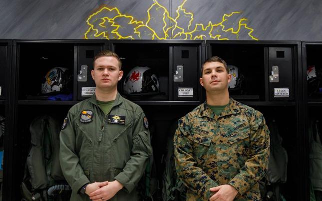 U.S. Marine Corps Gysgt. David Emerton, equal opportunity advisor for Headquarters and Headquarters Squadron, Marine Corps Air Station Iwakuni, watches his brother Staff Sgt. Billy Emerton, a flight equipment technician, with Marine Fighter Attack Squadron (VMFA) 242, Marine Aircraft Group 12, 1st Marine Air Wing.