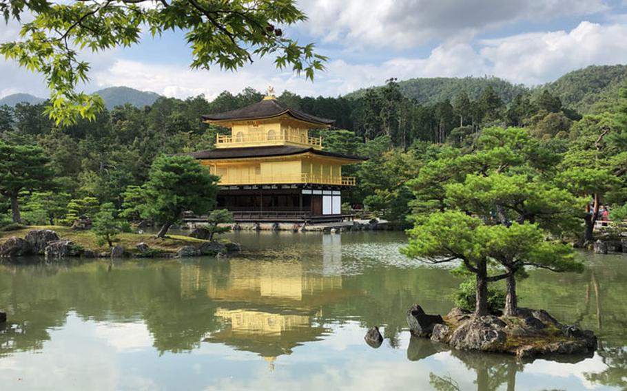 Kinkakuji (Golden Pavilion) - Designated a UNESCO World Heritage site, the Golden Pavillion and its garden were fashioned to represent the Buddhist's earthly paradise. The gorgeous, golden exterior is striking against the dark green forest and blue water pond in the garden surrounding it.