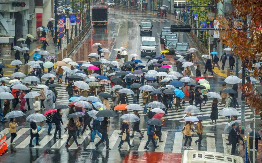 Shibuya Crossing from top view (raining season) in Tokyo, Japan