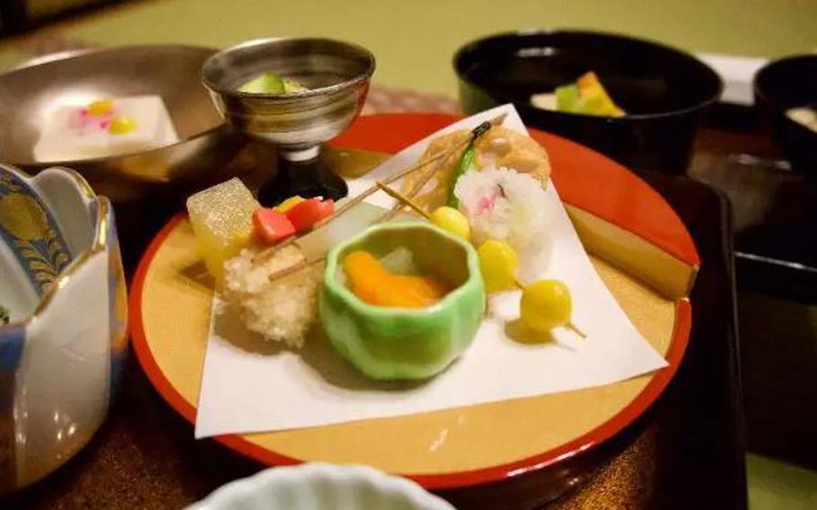 One plate of many! This dish had persimmon, lotus root, a vegetable maki roll, and beans