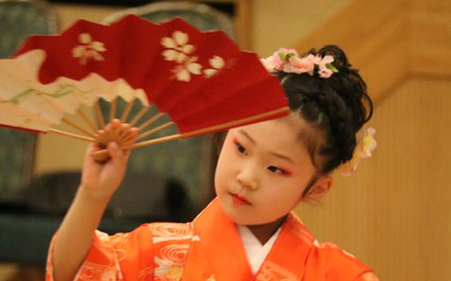A Japanese girl dancing traditional Japanese dance, nihon buyo.