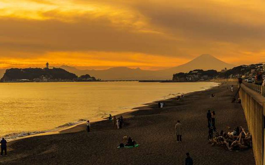 Enoshima and Mt. Fuji from beach at sunset