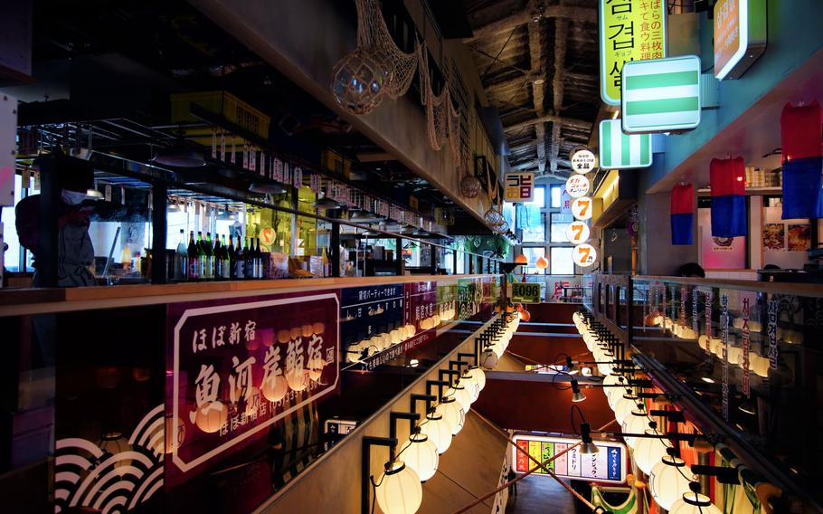 Restaurants in Yoyogi’s district illuminated with lanterns and colorful signboards