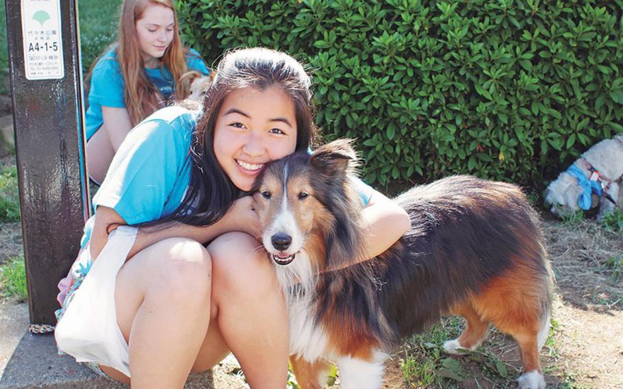 Rescued puppy and her AWT volunteer