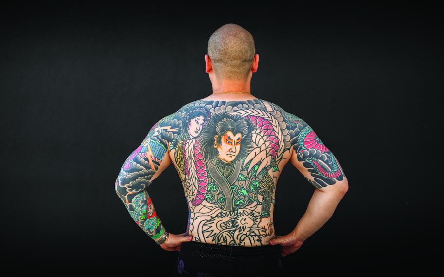 tattoos on a man’s back