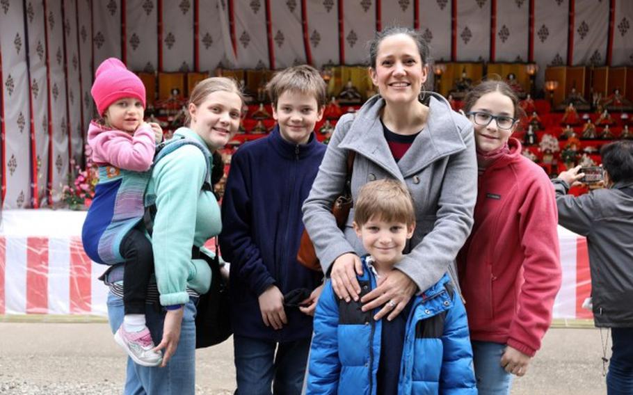 The Sikes family from Camp Zama poses for a photo March 3 at the Zama Shrine during “Hina Matsuri,” also called “Girl’s Day” or “Doll’s Day” in Japan. The family was at the shrine as part of a walking tour that Camp Zama’s Army Community Service organized. (Noriko Kudo)