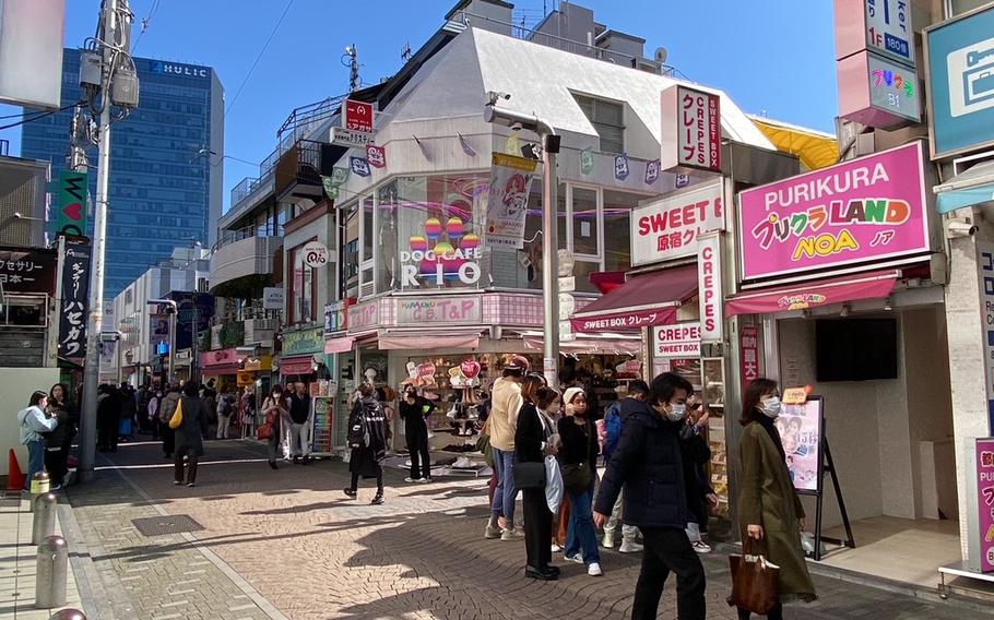 People are walking on Takeshita-dori Street.